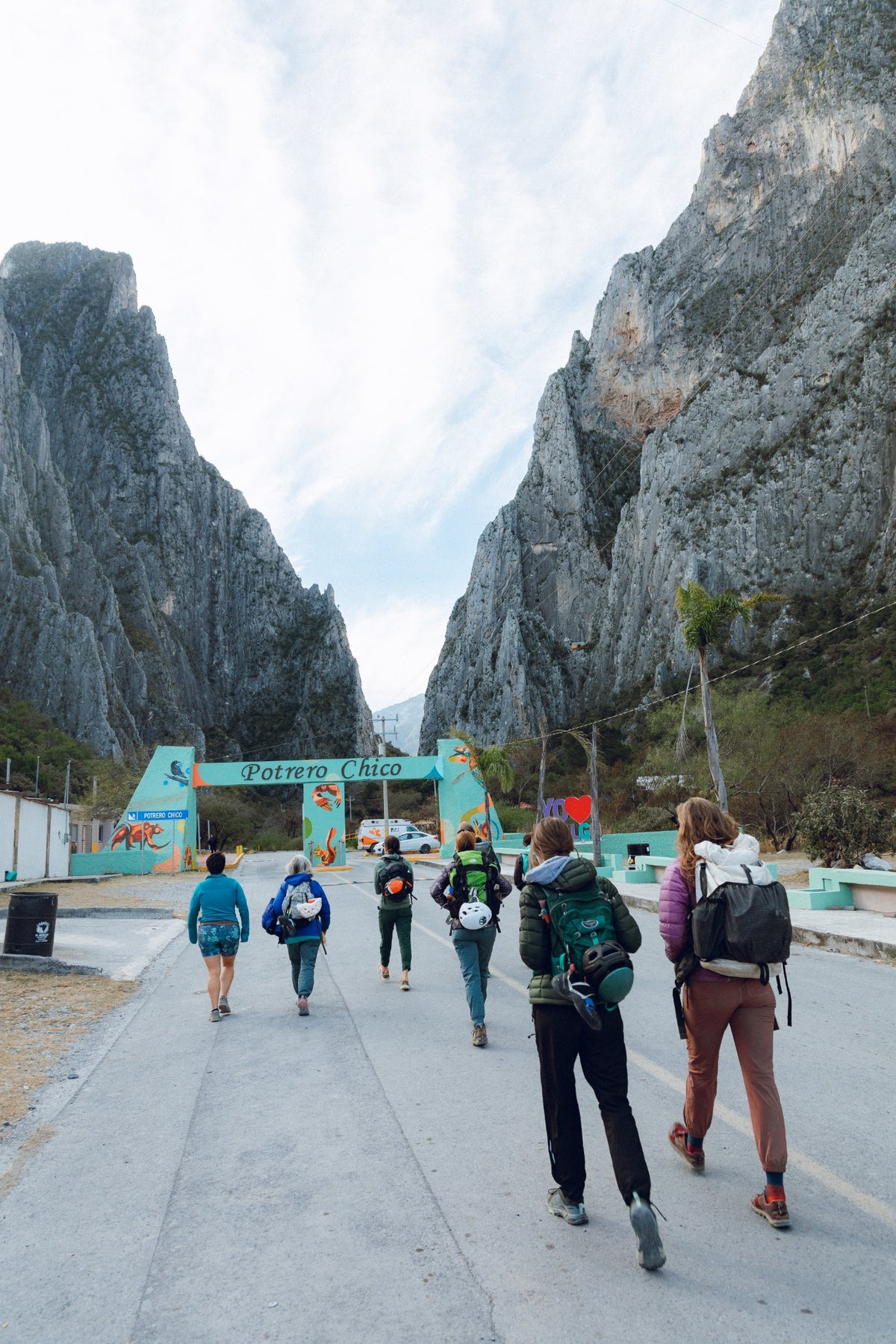 Guests carrying climbing packs on the walk into El Potrero Chico
